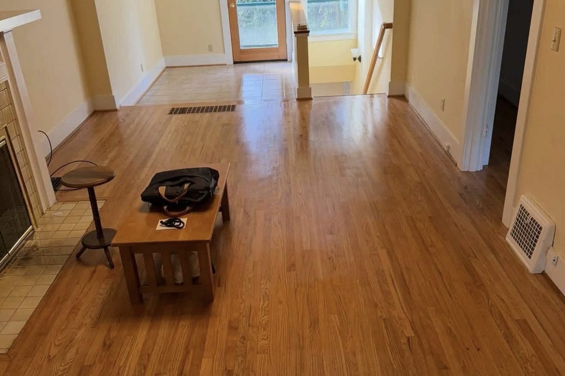 Empty living room with gleaming hardwood floors, freshly cleaned for a move-out in Albany, Oregon